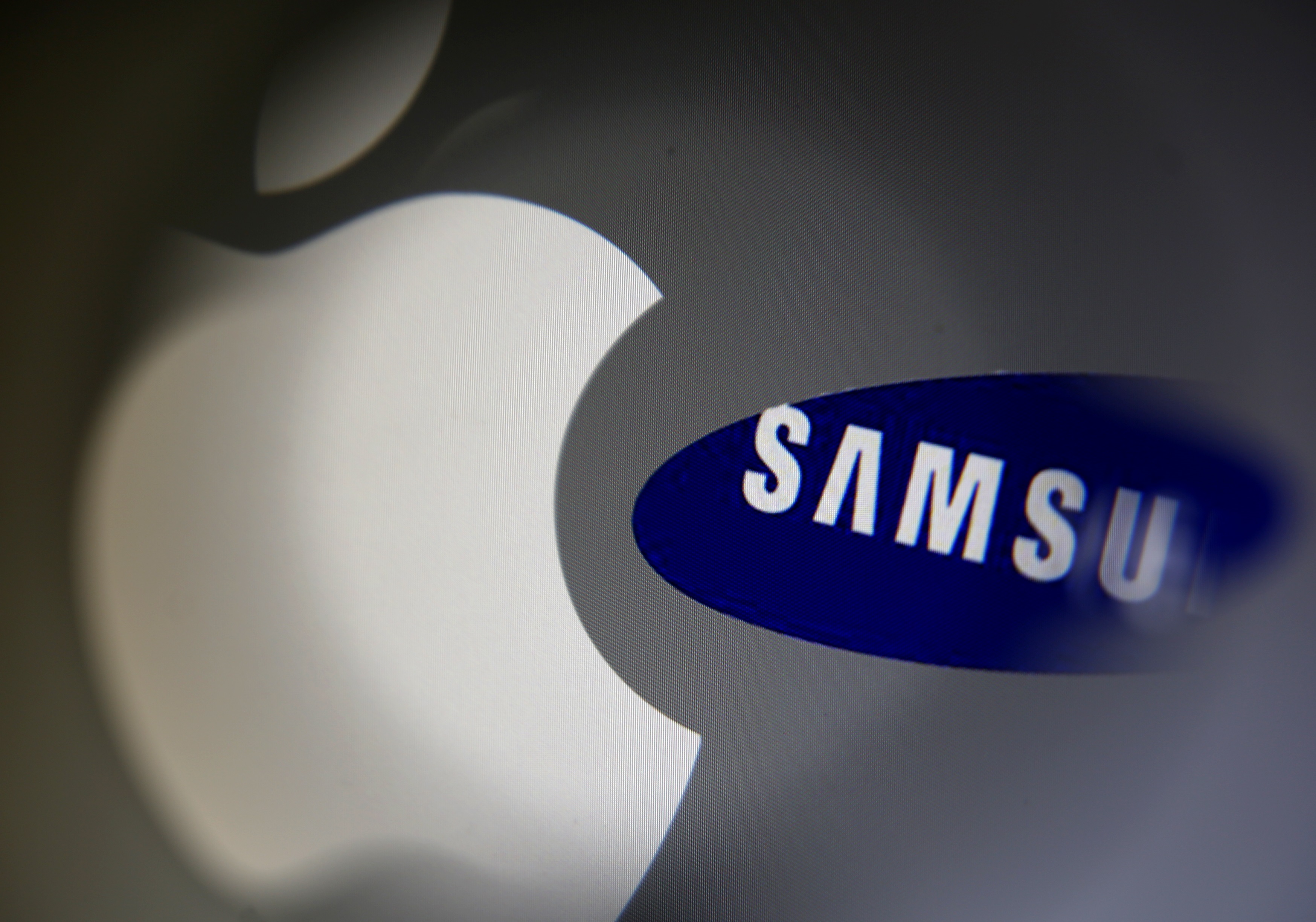 A Samsung logo and a logo of Apple are seen in this illustration photo in Sarajevo