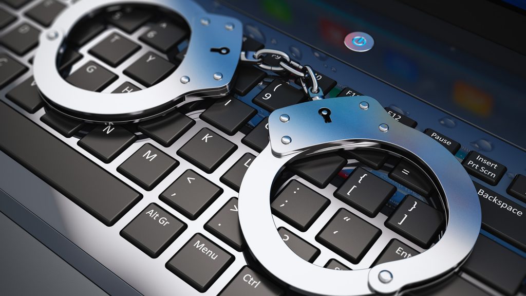 handcuffs-computer-cyber-keyboard-arrested